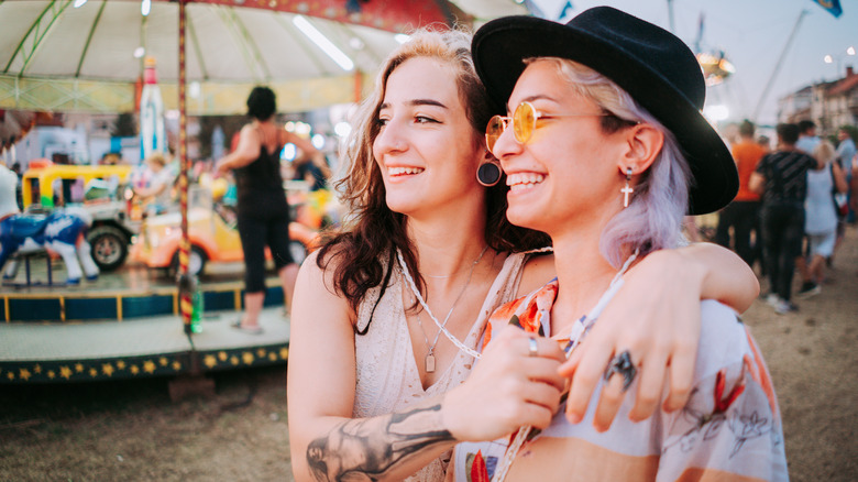 Two women smiling at carnival