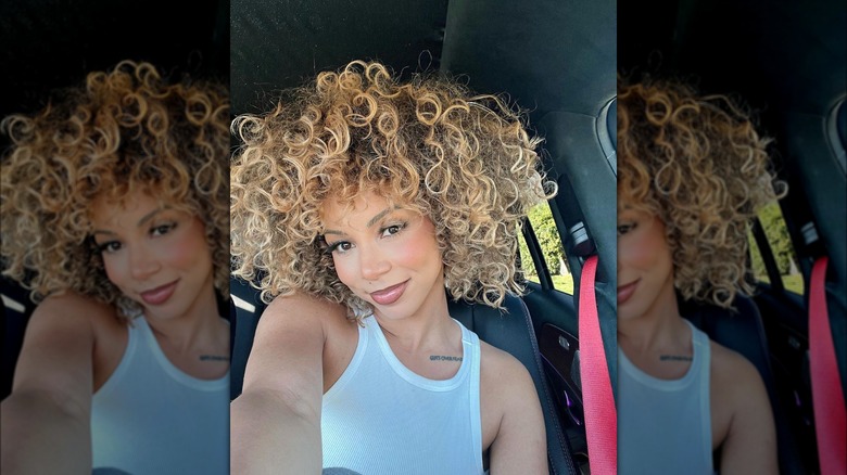 woman with blond curly hair