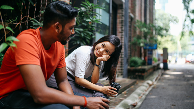 Young couple talking and smiling