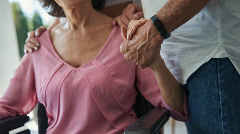 man giving woman support