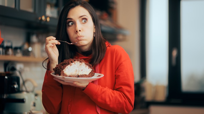 woman guilty about eating cake
