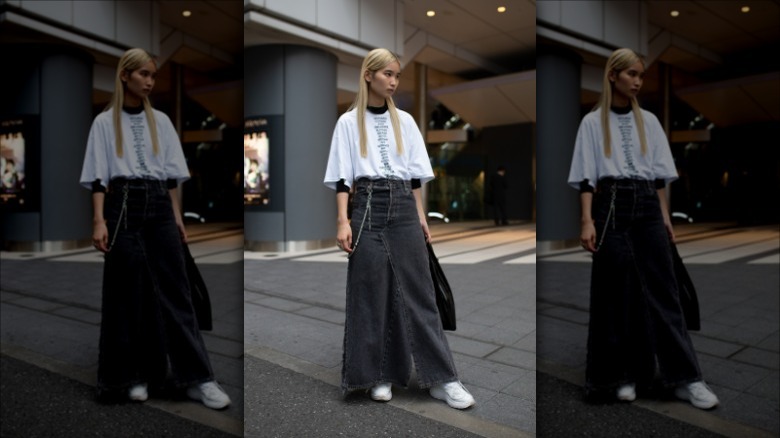 woman with white tee and washed black denim maxi skirt