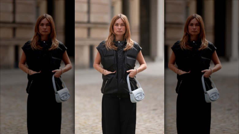 woman with denim shoulder bag