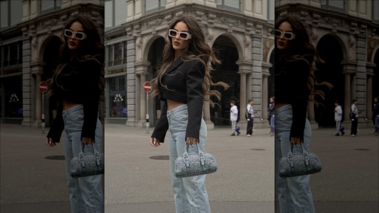 woman with bedazzled denim bag