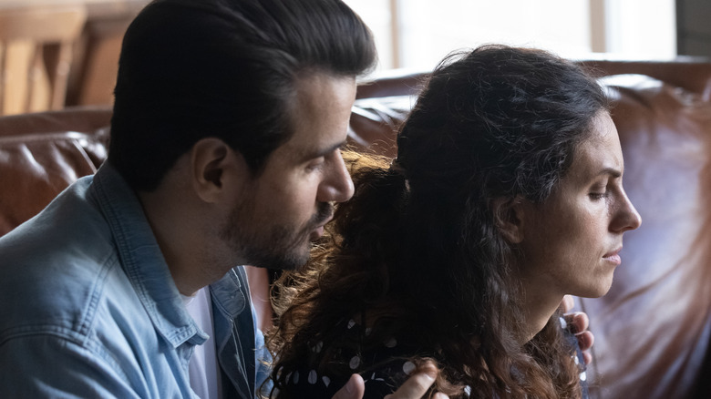 Man talking to woman