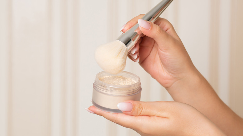 Woman using setting powder