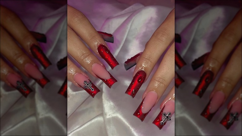 red nails with crosses