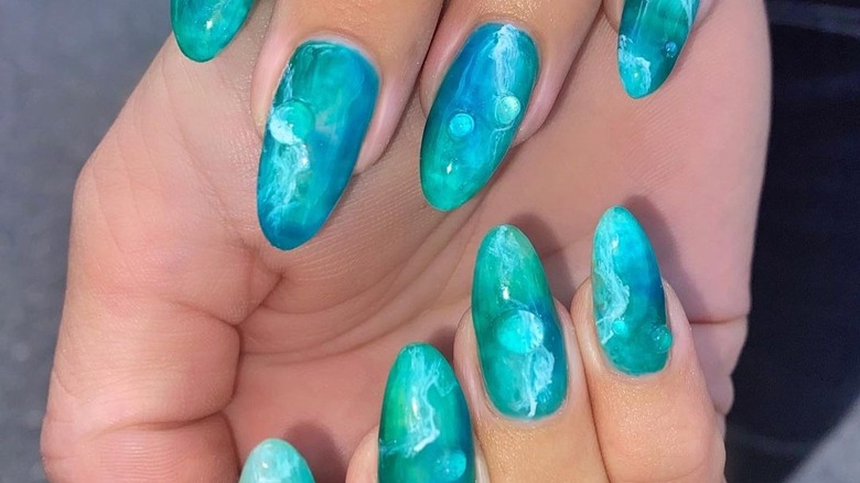 blue manicure with water droplet effect