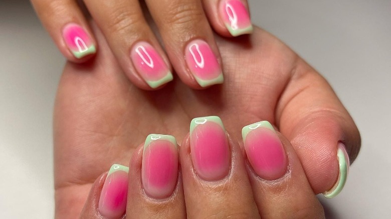 pink nails with green French tip 