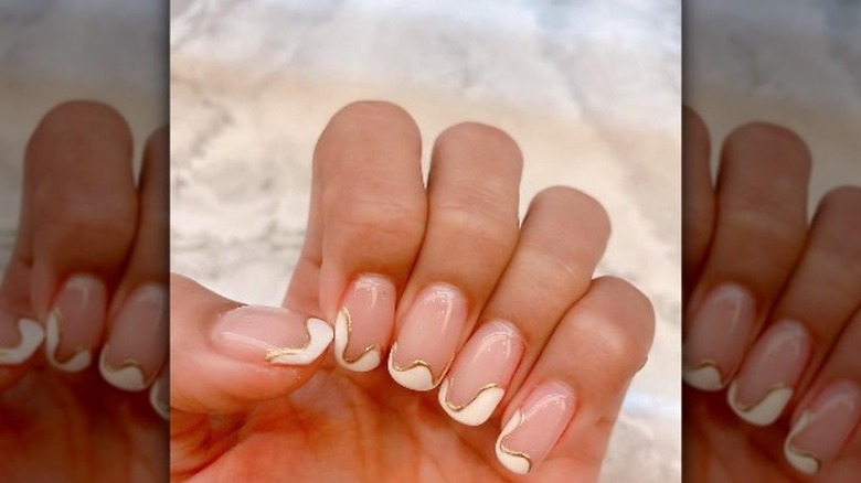 wavy French tips lined with gold