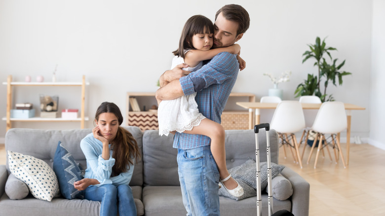 Man hugging child