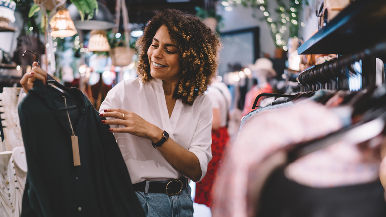 woman looking at clothing