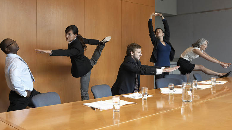 coworkers stretching together