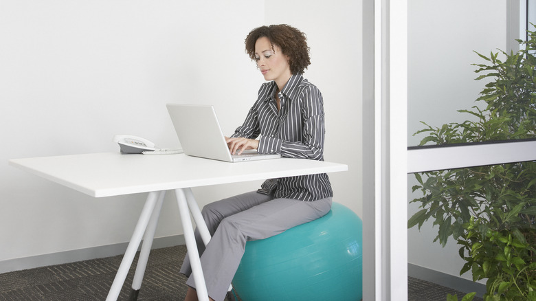 woman on exercise ball at desk