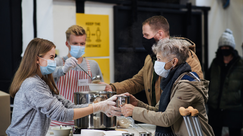 Woman working in soup kitchen