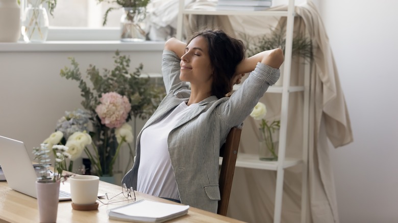 Woman relaxing at desk