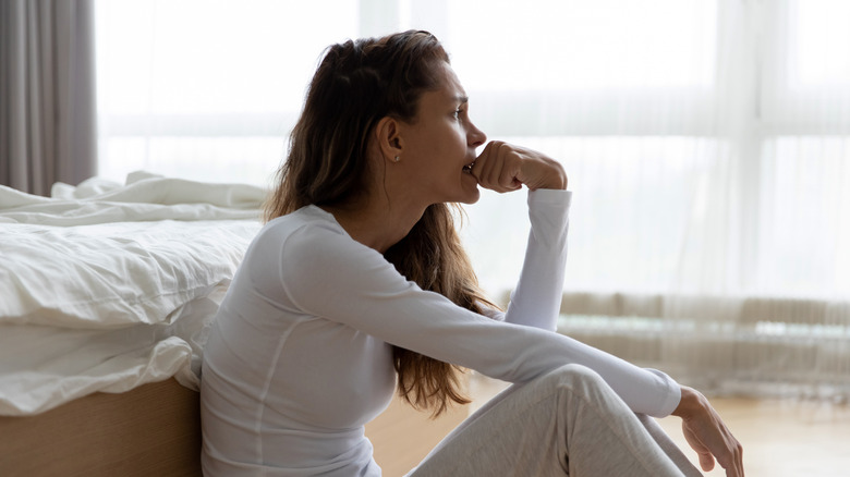 Woman worrying in her room