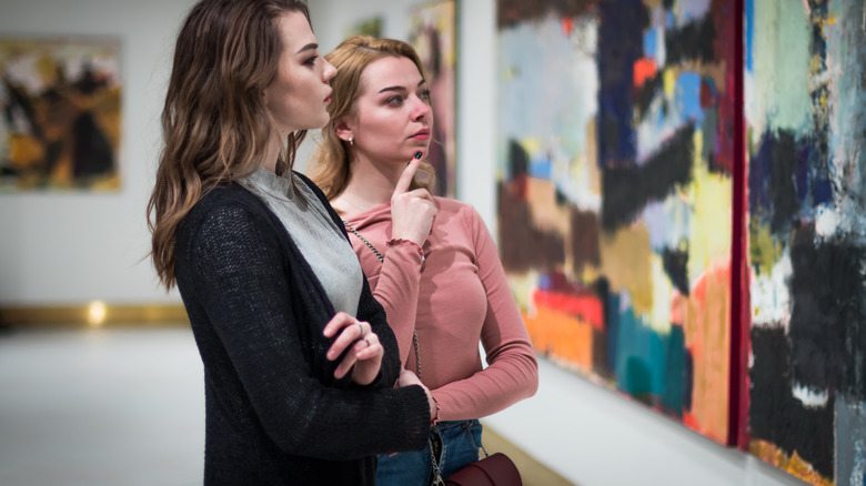 couple looking at paintings