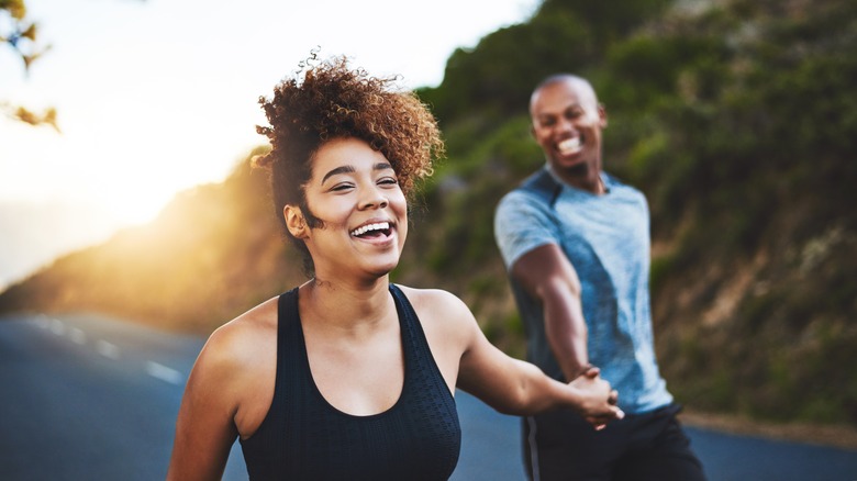 couple outdoors enjoying sunset