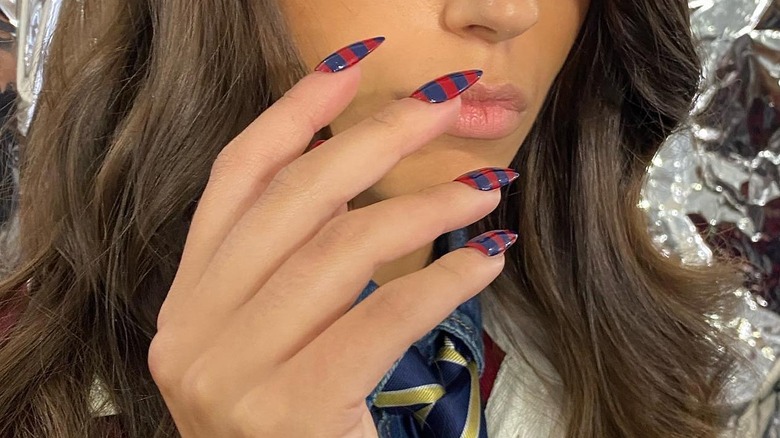 model with rugby striped nails