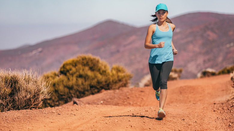 woman exercising in hat 