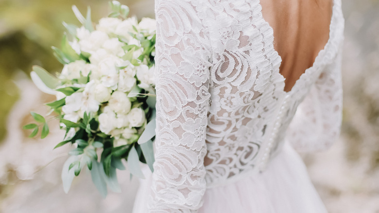 girl in wedding dress with bouquet