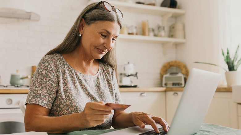 Older woman purchases gift online 