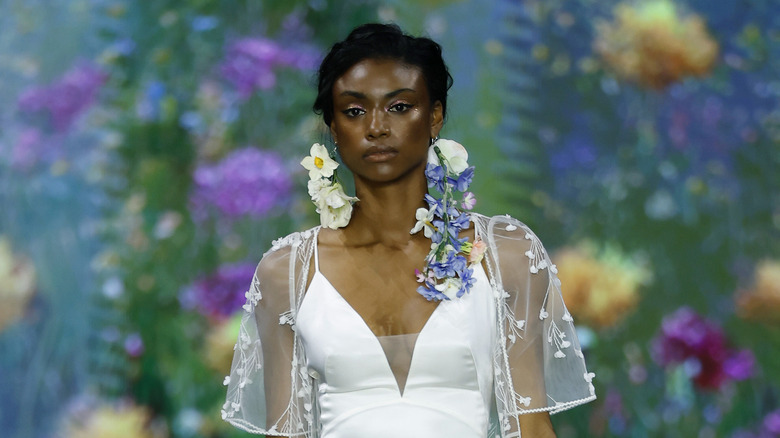 Model with pink eyeshadow and dewy skin