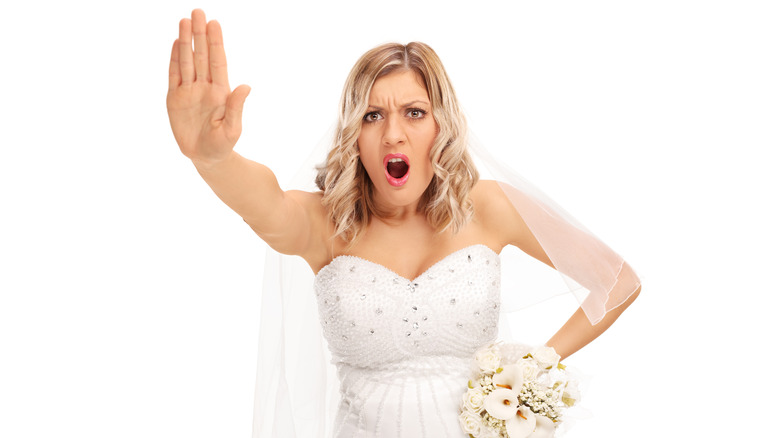 Angry bride with hand outstretched