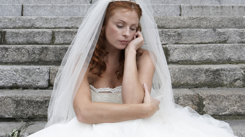Sad bride on steps