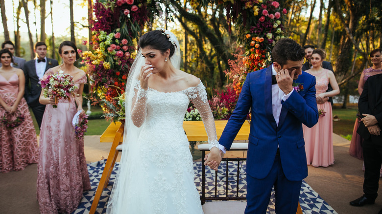 A bride and groom looking miserable