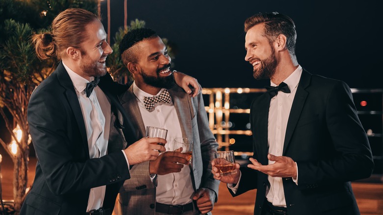 Two grooms and a friend