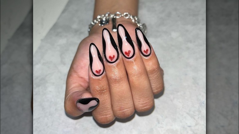 person with hourglass nails