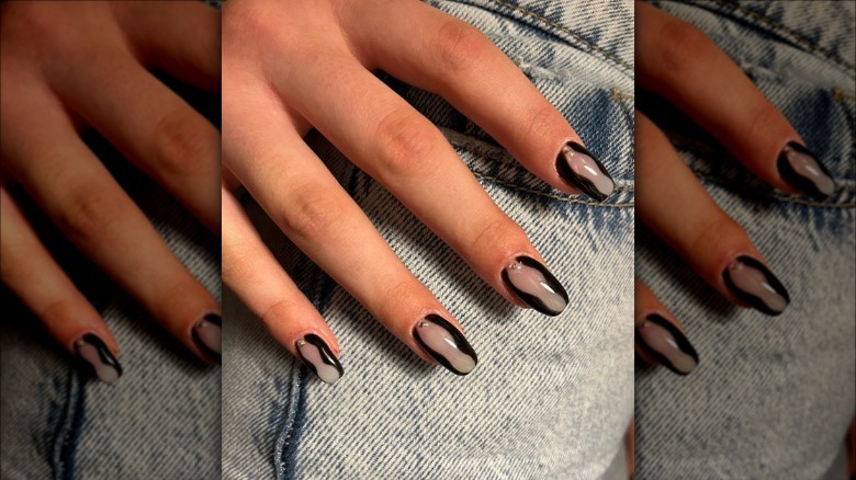 person with short hourglass nails