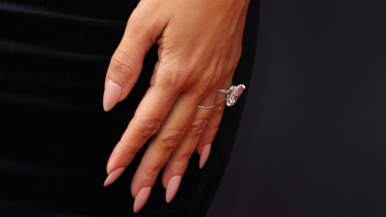 Kim Kardashian hand pink nails