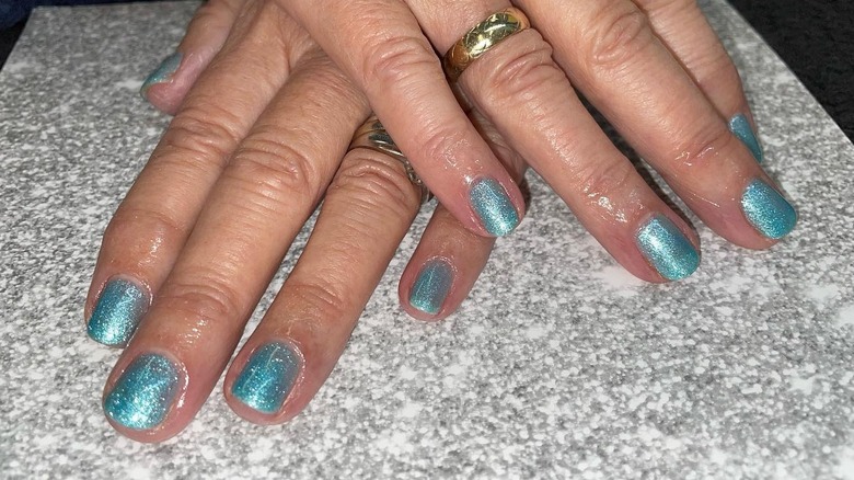 Manicure with sparkly blue nails