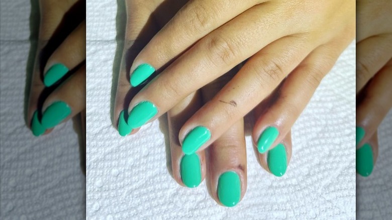 Manicure with green nails