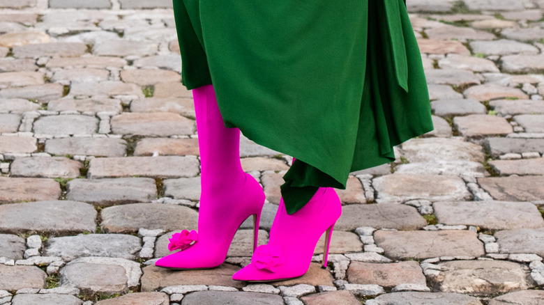 Bright pink stiletto boots