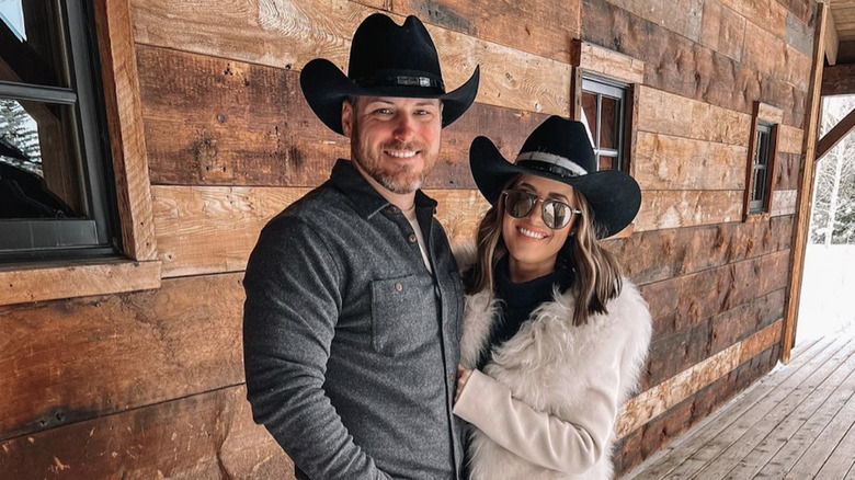 couple wearing cowgirl hats