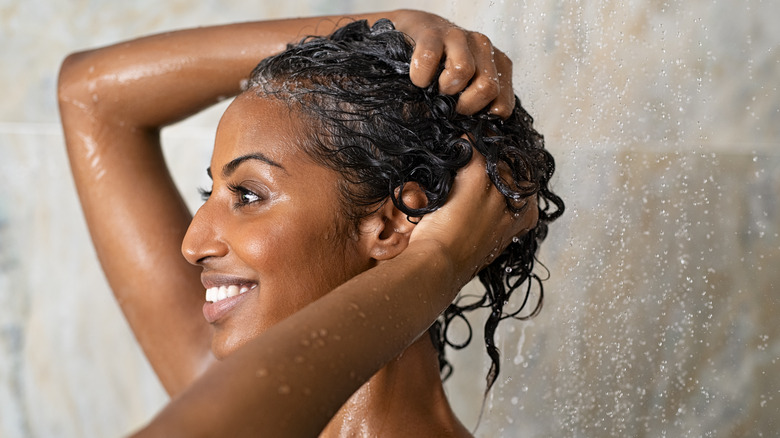 woman shampooing permed hair