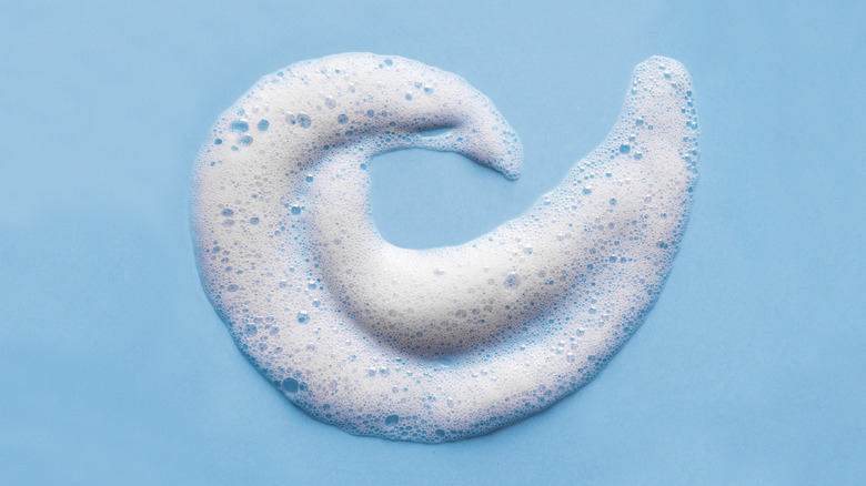 foaming cleanser on a blue background