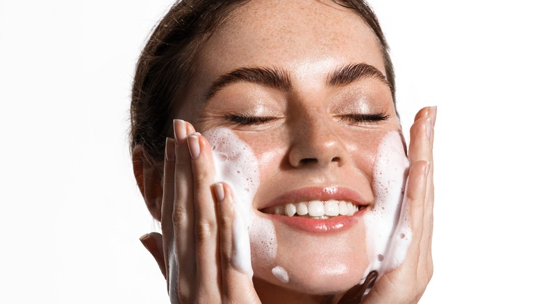 woman washing face