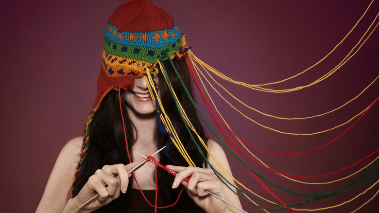 Woman knitting a hat 