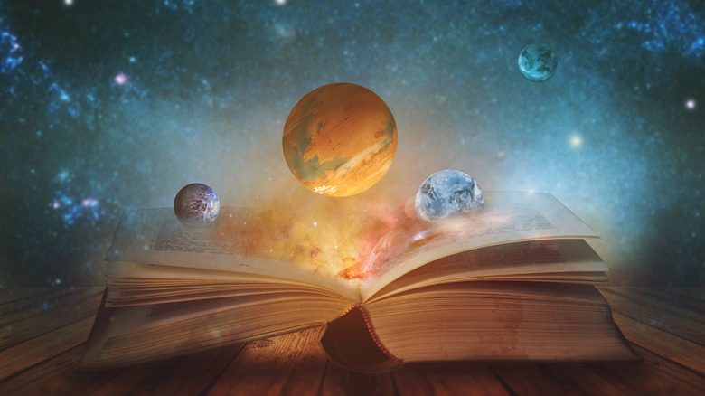 Open book with planets 