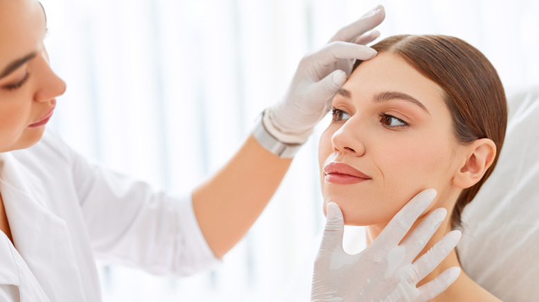 Person getting face examined 