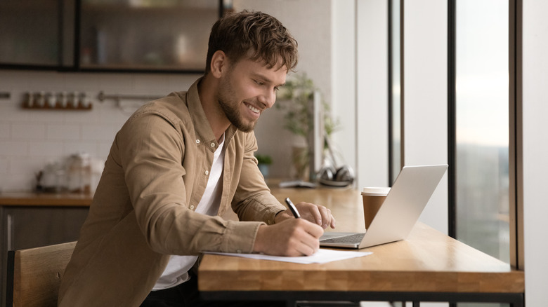 Man doing research on laptop