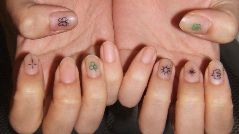 Nail tattoos on hands