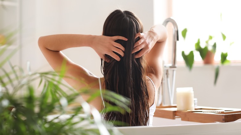 person massaging scalp
