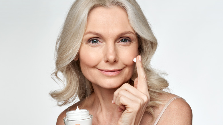 woman with skincare product