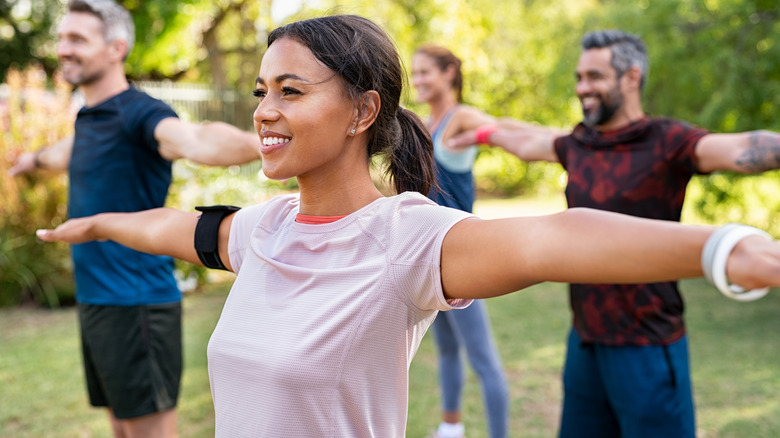 Woman smiling with outstretched arms